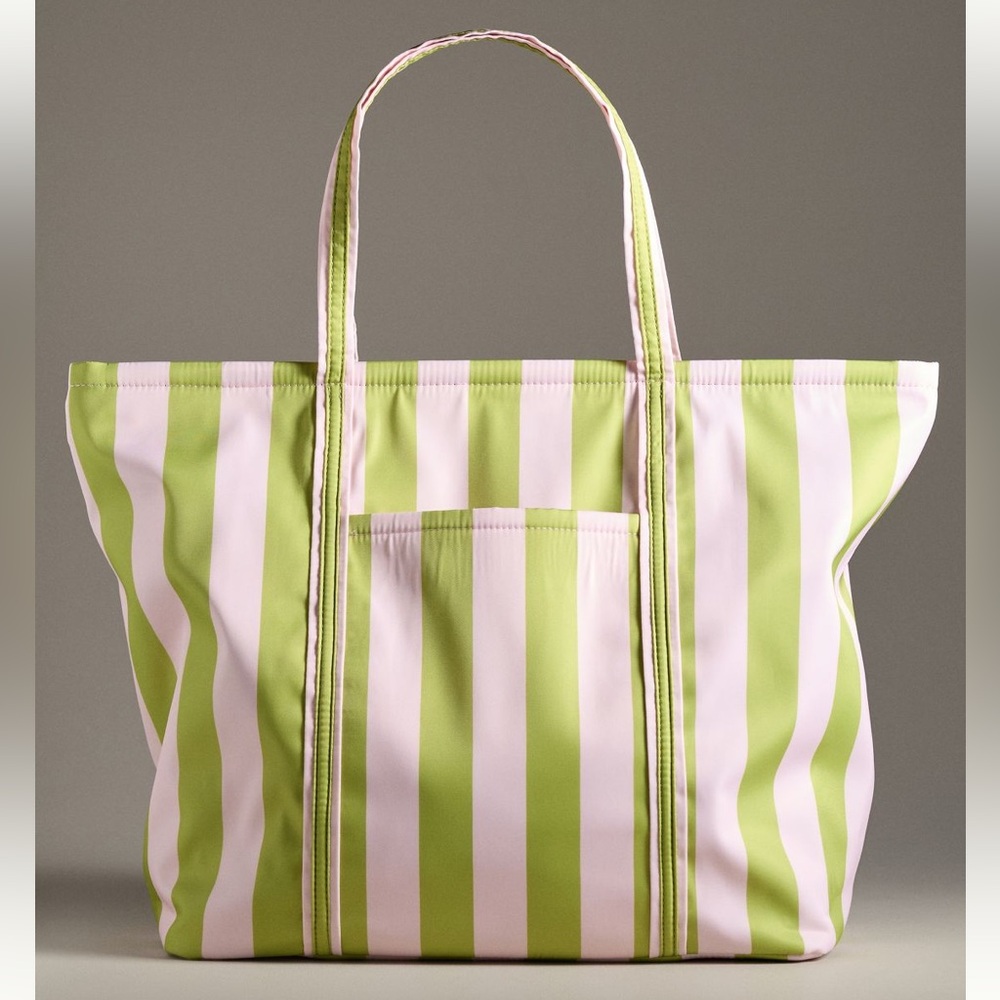 Anthropologie Stylish and spacious tote bag with green and pink stripes.